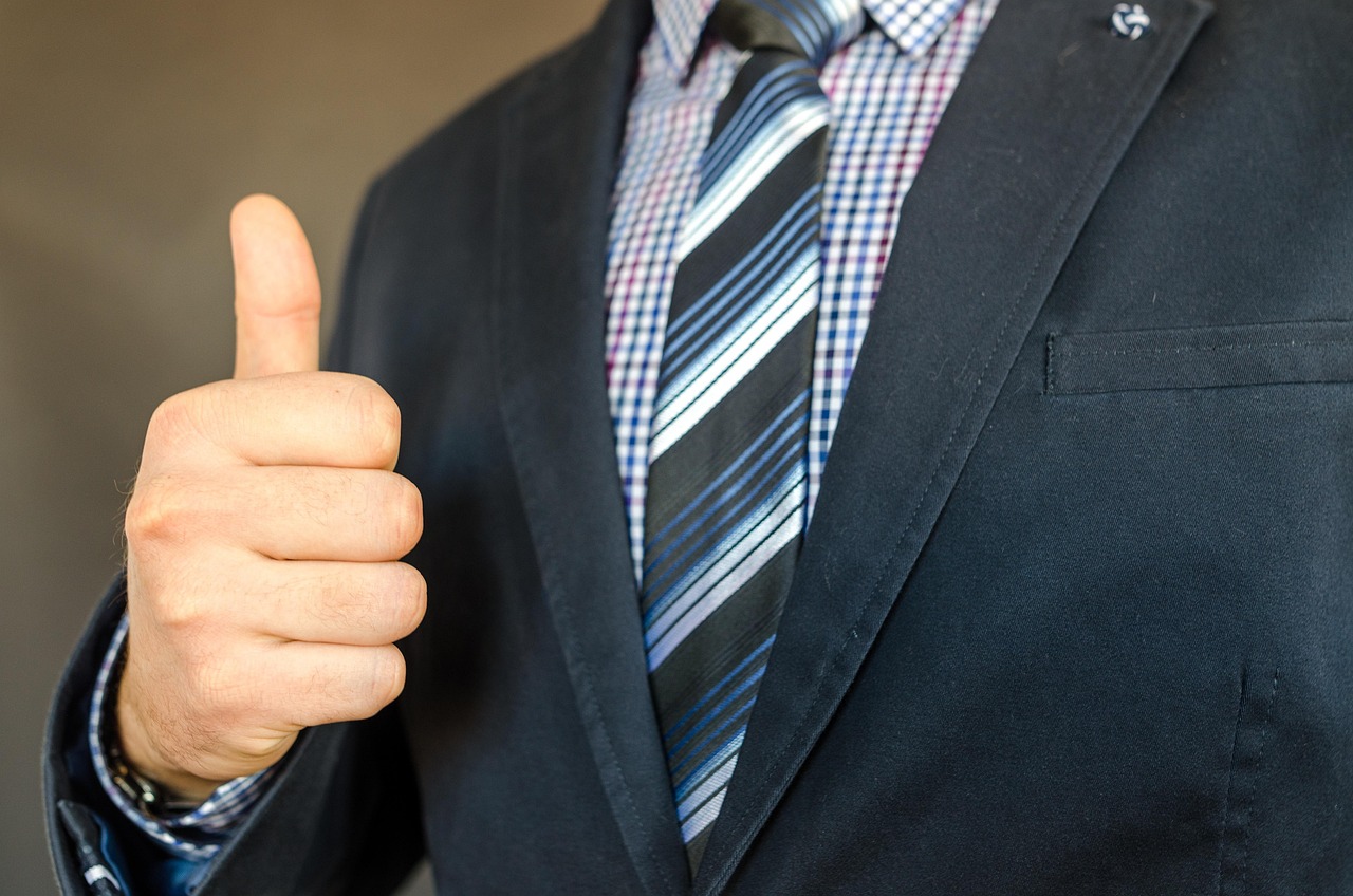 corporate man giving thumbs-up